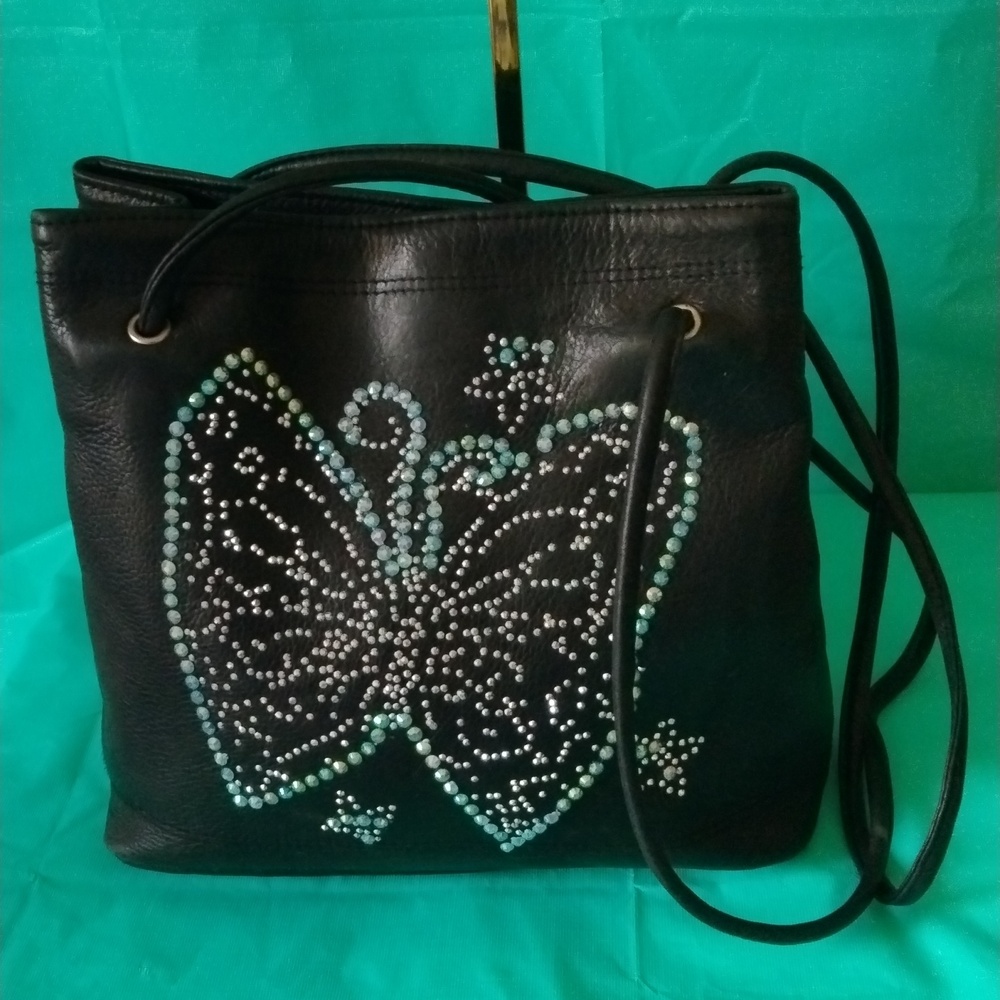 Tignanello leather shoulder bag with butterfly embellishment.